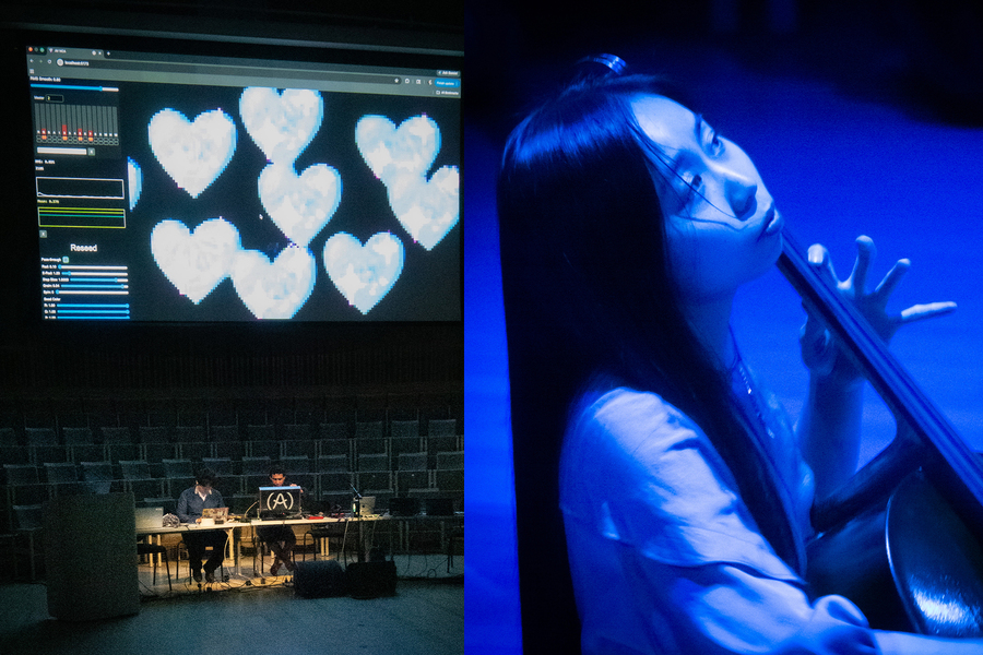 A screen with digital hearts projected onto alongside a woman playing a musical instrument in blue light.