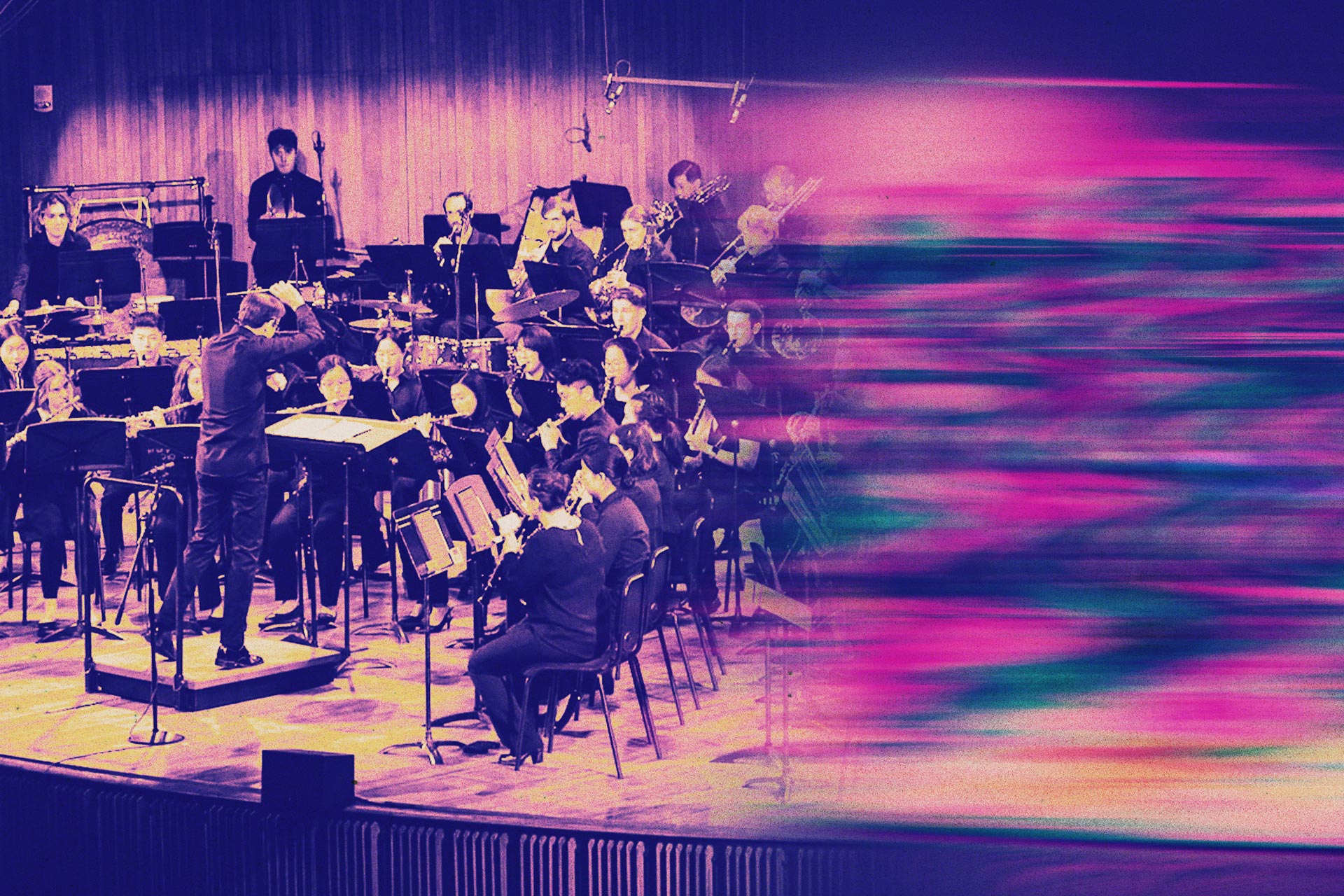 Symphony orchestra playing in a concert. in Kresge Auditorium at MIT.